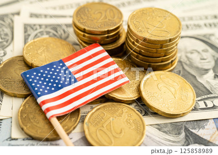 US America flag on coin and banknote money, finance trading investment business currency. US America flag on coin and banknote money, finance trading investment business currency. 125858989