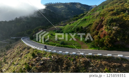 Motorcycle Rider Driving in High Mountain Landscape, Madeira Island , Portugal. 125859351