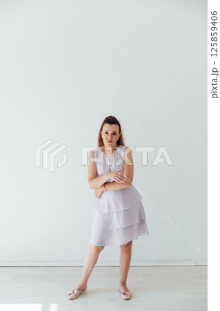 Brunette 40 years old in dress dancing music Brunette 40 years old in dress dancing music 125859406