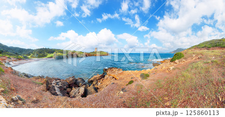 Attractive morning view of Piscinni bay with turquoise sea and famous coastal tower of Piscinni. Attractive morning view of Piscinni bay with turquoise sea and famous coastal tower of Piscinni. 125860113