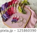 embroidery of flowers in French knot technic, canvas, threads mouline and needle 125860390