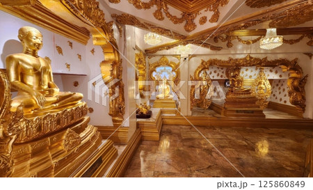 Ornate Golden Buddha Statues in Luxurious Decorative Temple Interior Ornate Golden Buddha Statues in Luxurious Decorative Temple Interior 125860849