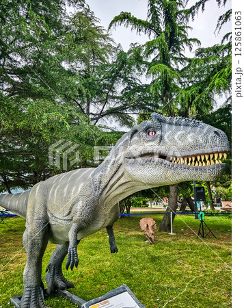 Feathered T-Rex and Dinosaurs in Summer Vacation Park Feathered T-Rex and Dinosaurs in Summer Vacation Park 125861063