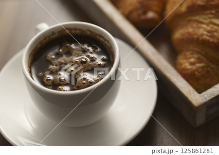 fresh croissant and cup of espresso fresh croissant and cup of espresso 125861281