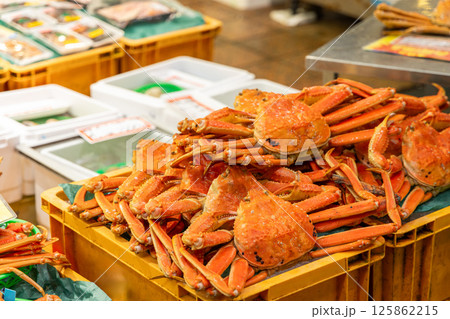 Boiled crabs stacked on a yellow crate at a Japanese seafood market 125862215