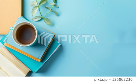 Books and coffee mug or tea for relaxing time reading copy space background 125862230