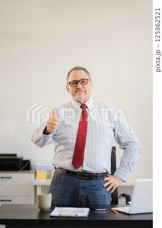 Businessman using laptop computer in office. success man, entrepreneur, small business owner working online. Businessman using laptop computer in office. success man, entrepreneur, small business owner working online. 125862521