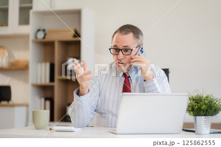 Lifestyle people, Mature male talking mobile phones and working on laptop computers, online business, work from home, teleworking concept. 125862555