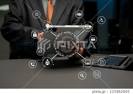 Copyright or patent concept, Person hand using laptop computer, tablet and smartphone with virtual screen copyright icon trademark, Creation ownership against piracy at office. Copyright or patent concept, Person hand using laptop computer, tablet and smartphone with virtual screen copyright icon trademark, Creation ownership against piracy at office. 125862605
