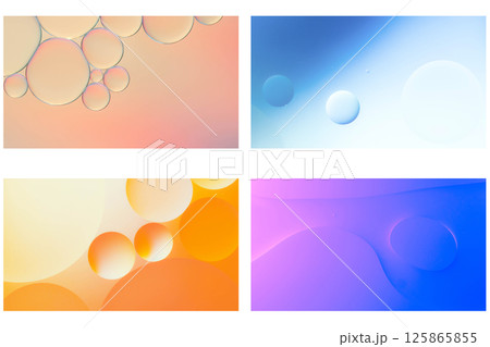 Gentle abstract macro shots of oil droplets floating in water, featuring pastel tones of orange, blue, pink, and violet. Ideal for modern minimalist designs, wellness themes, or soothing visual 125865855