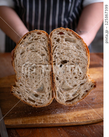 Baker Hand Presenting Sourdough. 125867399