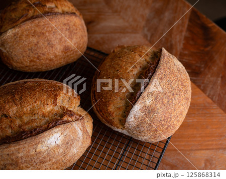 Freshly Baked Sourdough Loaf on Cafe table. Freshly Baked Sourdough Loaf on Cafe table. 125868314