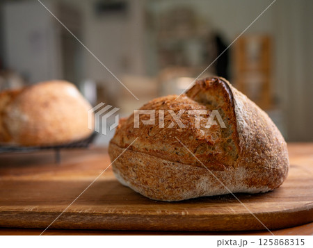 Crusty Artisan Sourdough Bread Close-Up. Crusty Artisan Sourdough Bread Close-Up. 125868315