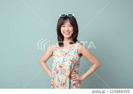 Southeast asian woman smiles confidently as small business owner in creative retail industry, representing startup with online store and shopping focus 125868350