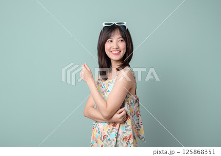 Southeast asian woman small business owner retail shopping startup creative industry online store smiling happy confident wearing floral dress and sunglasses on head 125868351