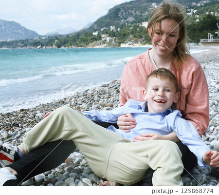 happy mother on the beach with children. lifestyle people 125868774