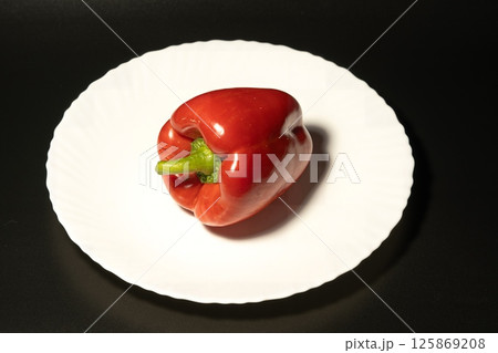 Bell pepper on a black background Bell pepper on a black background 125869208