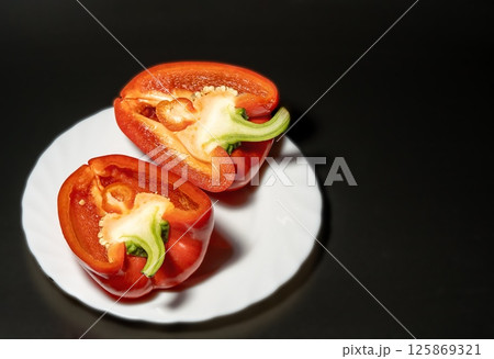 Bell pepper on a black background 125869321