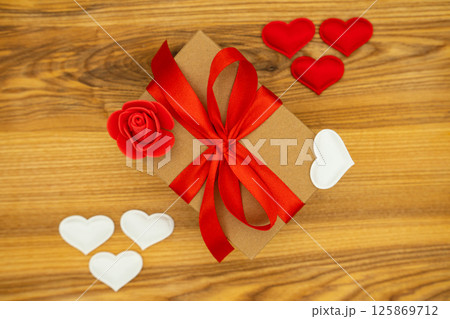Gift box on the wooden background. Valentine's day celebration Gift box on the wooden background. Valentine's day celebration 125869712