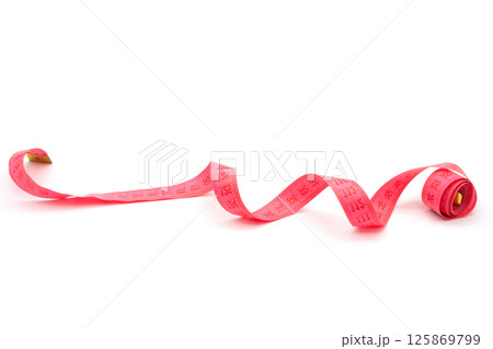 Isolated metric measuring tape on white background. Isolated metric measuring tape on white background. 125869799