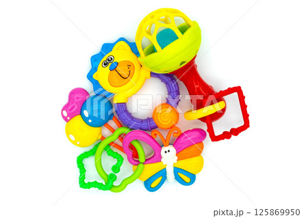 Colorful baby toys on white. Toys for newborns. Kids toys. Top view Colorful baby toys on white. Toys for newborns. Kids toys. Top view 125869950