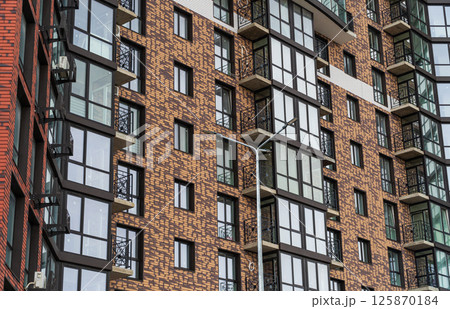 Facade of modern multi-storey buildings in Europe. Contemporary Residential Building Exterior 125870184