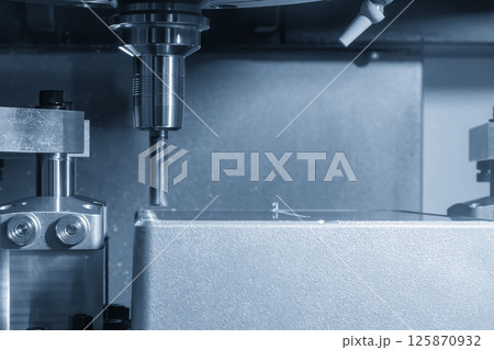 The CNC milling machine rough cutting the aluminum housing parts with flat nose end mill tool. 125870932