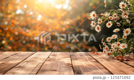 Empty wooden table with autumn white flower background. 125871092