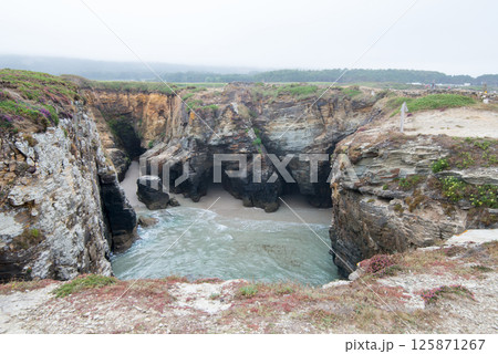 Beautiful aerial view of caves of Cathedrals beach, Galizia, Spain Beautiful aerial view of caves of Cathedrals beach, Galizia, Spain 125871267