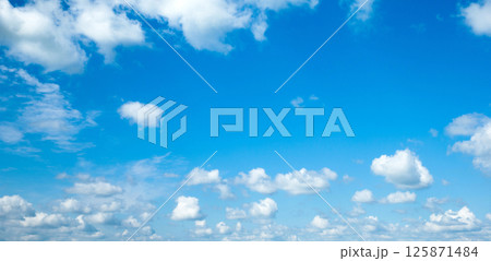 blue sky background with tiny clouds blue sky background with tiny clouds 125871484