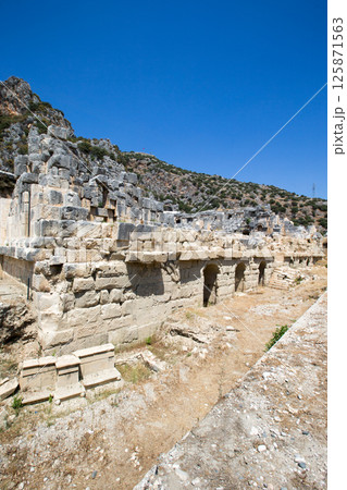 Ancient lycian necropolis with tomb carved in rocks in Mira 125871563