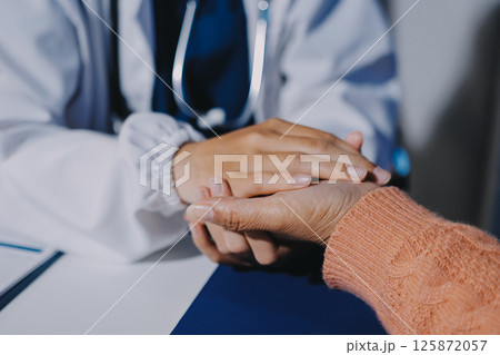 Asian female hands touching old female hand Helping hands take care of the elderly concept in hospital. 125872057