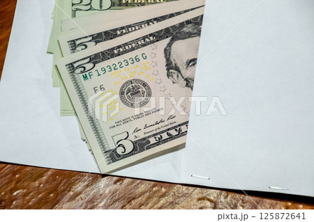 Dollars on table with an envelope. Money in an envelope. U.S. dollars. 125872641