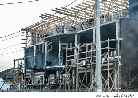Construction of a multistorey residential building. Share constr Construction of a multistorey residential building. Share constr 125872667