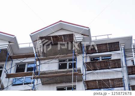 Construction of a multistorey residential building. Share constr Construction of a multistorey residential building. Share constr 125872678