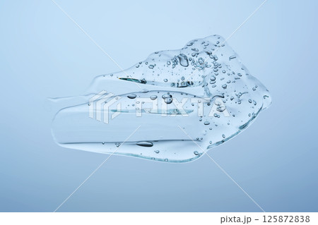 A cosmetic gel swatch on a blue background. 125872838