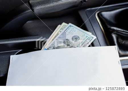 wad of dollars inside the car. 125872893