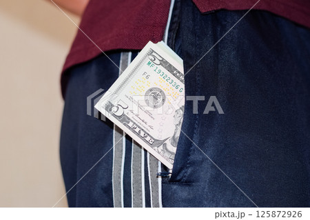 wad of money in the pocket of a man's pants. Dollars in your pocket. wad of money in the pocket of a man's pants. Dollars in your pocket. 125872926