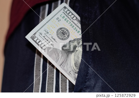 wad of money in the pocket of a man's pants. Dollars in your pocket. wad of money in the pocket of a man's pants. Dollars in your pocket. 125872929