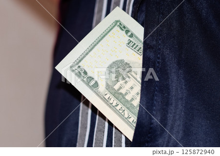 wad of money in the pocket of a man's pants. Dollars in your pocket. wad of money in the pocket of a man's pants. Dollars in your pocket. 125872940