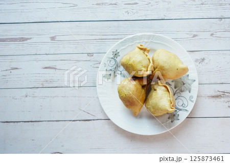 top view of indian street for singara on a plate  125873461