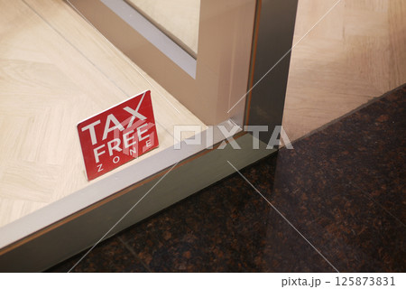 Sign indicating tax-free zone at retail location entrance Sign indicating tax-free zone at retail location entrance 125873831