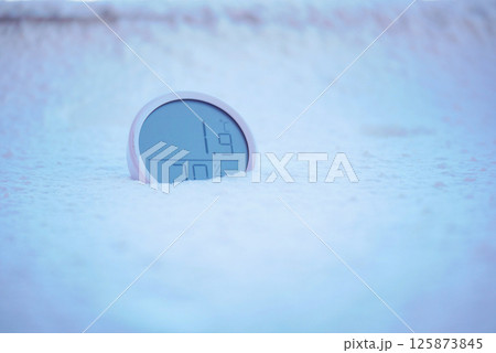 Digital thermometer shows low temperature in snow Digital thermometer shows low temperature in snow 125873845