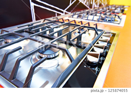 Modern gas stoves in store Modern gas stoves in store 125874055