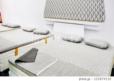 Gray mattress on double bed in store Gray mattress on double bed in store 125874110