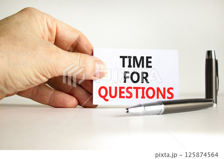 Time for questions symbol. Concept words Time for questions on beautiful white card. Beautiful white background. Businessman hand. Business time for questions concept. Copy space. 125874564