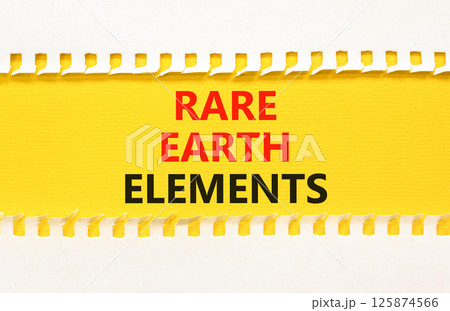 Rare earth elements symbol. Concept words Rare earth elements on beautiful yellow paper on clothespin. Beautiful white paper background. Business and rare earth elements concept. Copy space. 125874566