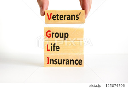 VGLI Veterans Group Life Insurance symbol. Concept word VGLI Veterans Group Life Insurance on blocks. Beautiful white background. Business VGLI Veterans Group Life Insurance concept. Copy space. 125874706