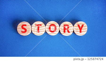 Story symbol. Concept word Story on beautiful wooden circles. Beautiful blue table blue background. Business lifestyle story concept. Copy space. Story symbol. Concept word Story on beautiful wooden circles. Beautiful blue table blue background. Business lifestyle story concept. Copy space. 125874724