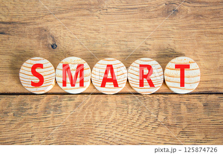 Smart symbol. Concept word Smart on beautiful wooden circles. Beautiful wooden table wooden background. Business lifestyle smart concept. Copy space. Smart symbol. Concept word Smart on beautiful wooden circles. Beautiful wooden table wooden background. Business lifestyle smart concept. Copy space. 125874726